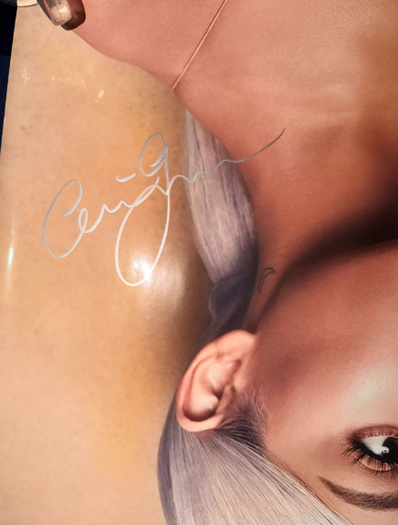 Ariana Grande – Sweetener signed poster (silver signature, from the premiere red carpet)