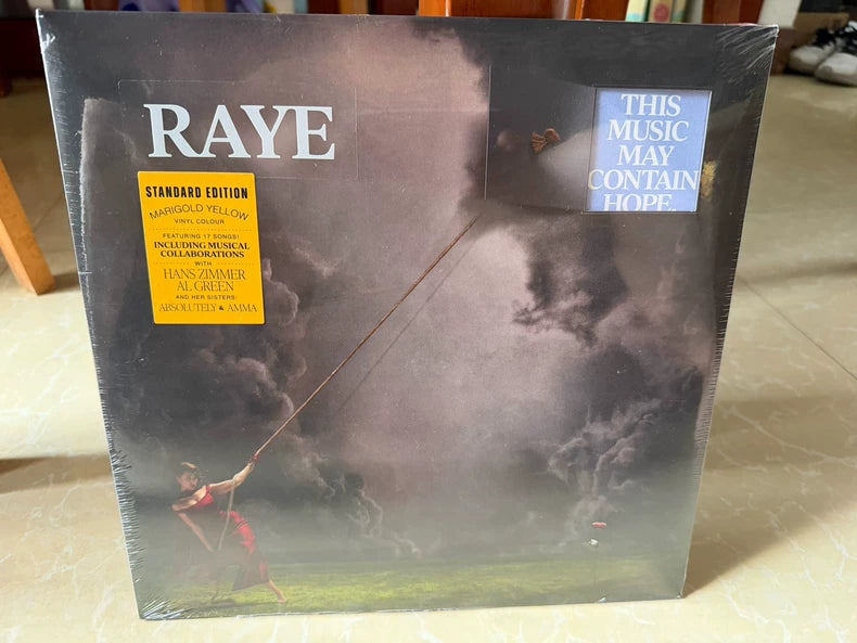 RAYE – This Music May Contain Hope. – Marigold Yellow Vinyl (2LP)